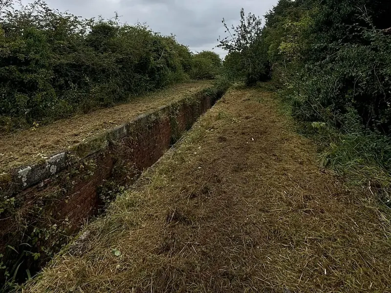Slite clearance on a lock and river bank